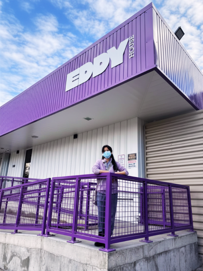 Fen, an Eddy House volunteer, standing outside Eddy House in Reno